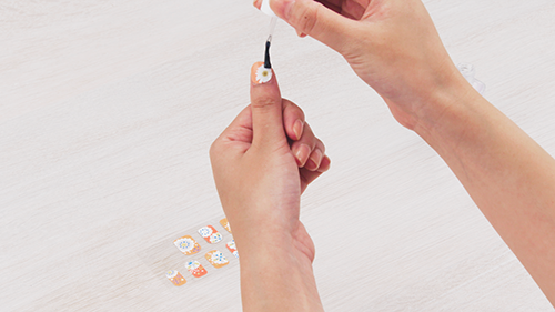 figure: Applying nail stickers
